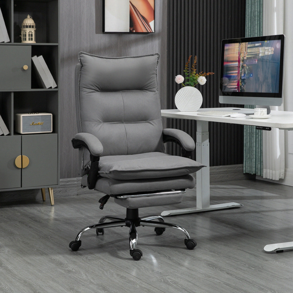 Gray office chair in a home office setting with a desk and computer monitor.