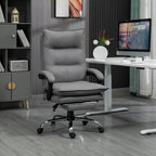 Gray office chair in a home office setting with a desk and computer monitor.