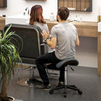 Swivel Saddle Stool with Wheels and Adjustable Height, Padded and Upholstered in Faux Leather, Grey