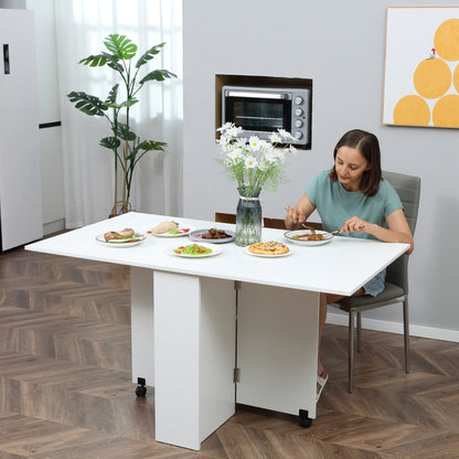 LEAF - Foldable Dining Table for 4-6 People with 2 Wheels, Space-Saving Leaf Table with 2 Storage Shelves, 140x75x74cm, White